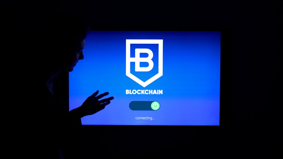 Silhouette of a person interacting with a blockchain technology display screen, showcasing digital innovation.
